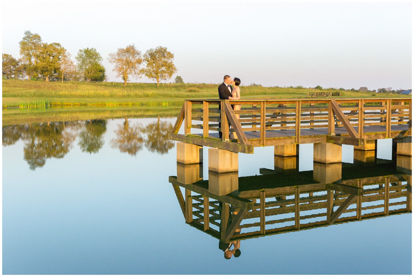 Fall sunset engagement session on a dock at White Hall State Historic Site in Richmond, Kentucky.