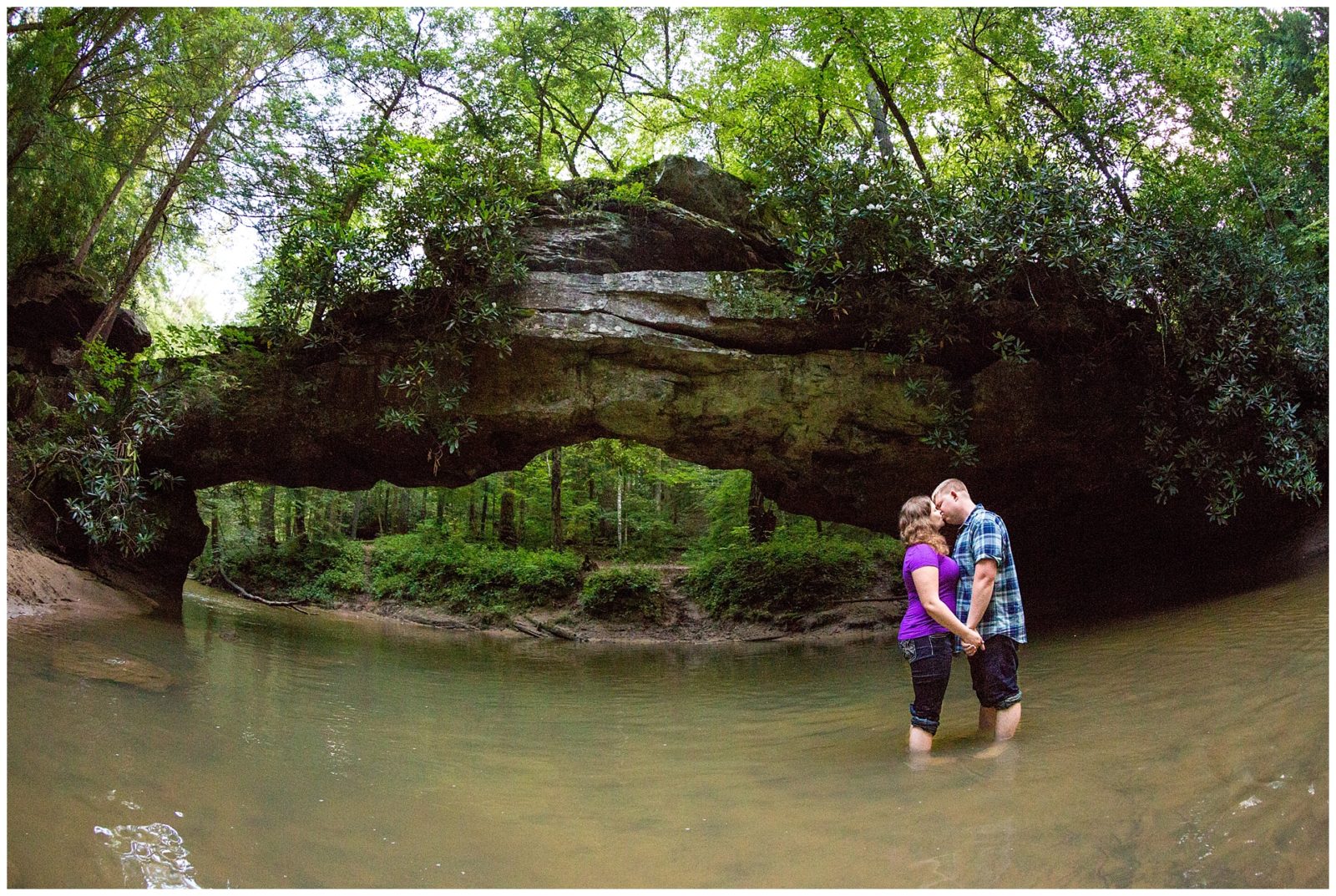 Adventurous Red River Gorge engagement session filled with rock climbing, a waterfall & a beautiful arch formation all in the lovely state of Kentucky. Photo by: Kevin and Anna Photography www.kevinandannaweddings.com