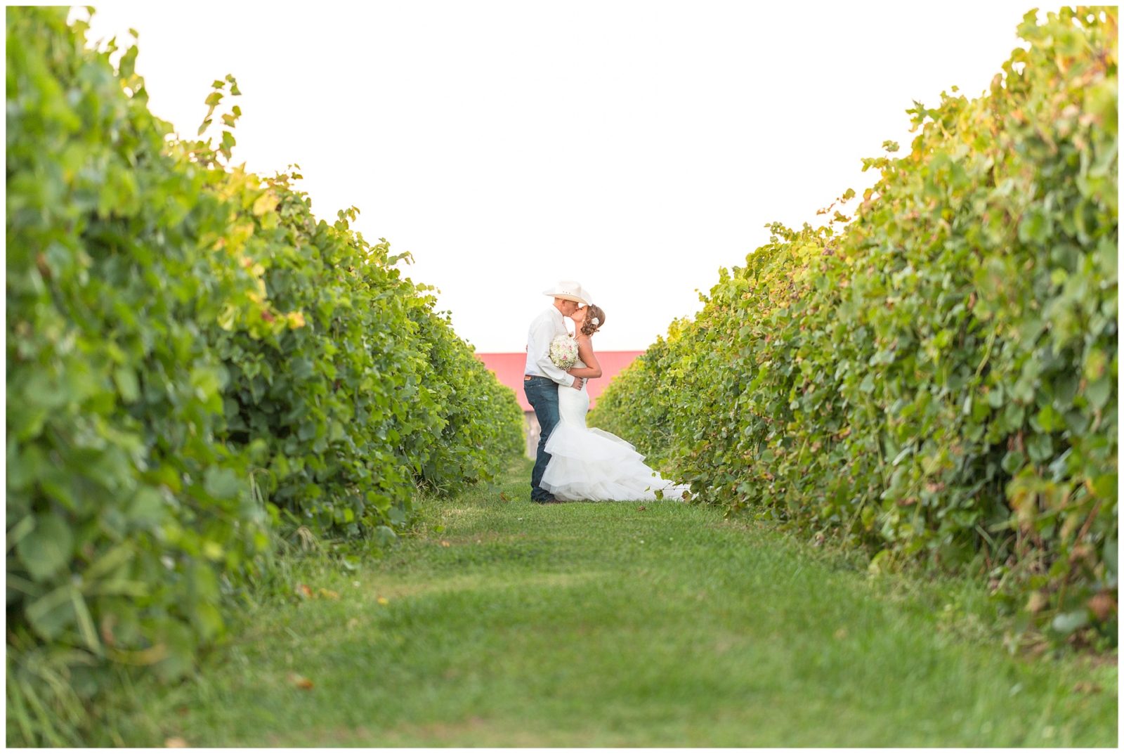Beautiful outdoor wedding at Talon Winery in Lexington, Kentucky. The vineyards, rolling hills, barns, and lake are absolutely stunning during golden hour. Photo by: Kevin and Anna Photography www.kevinandannaweddings.com