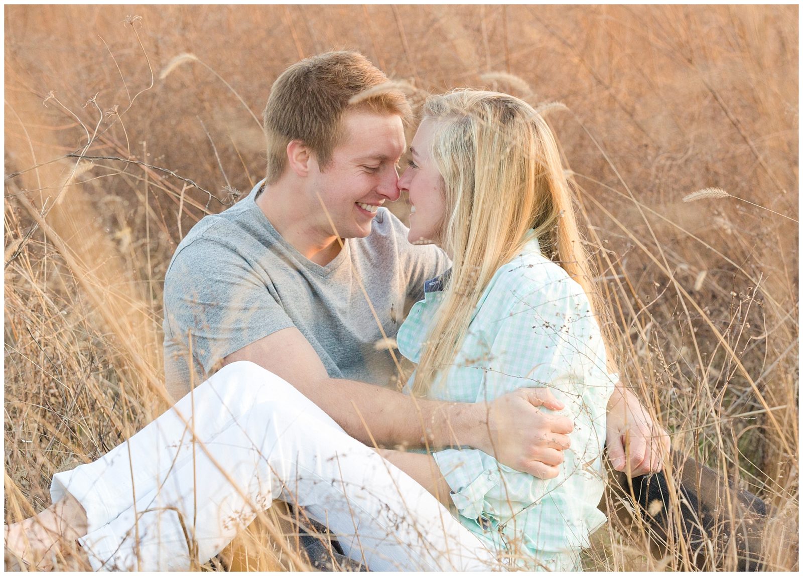 Couple in tall grass during an engagement session at Shaker Village in Harrodsburg, KY.