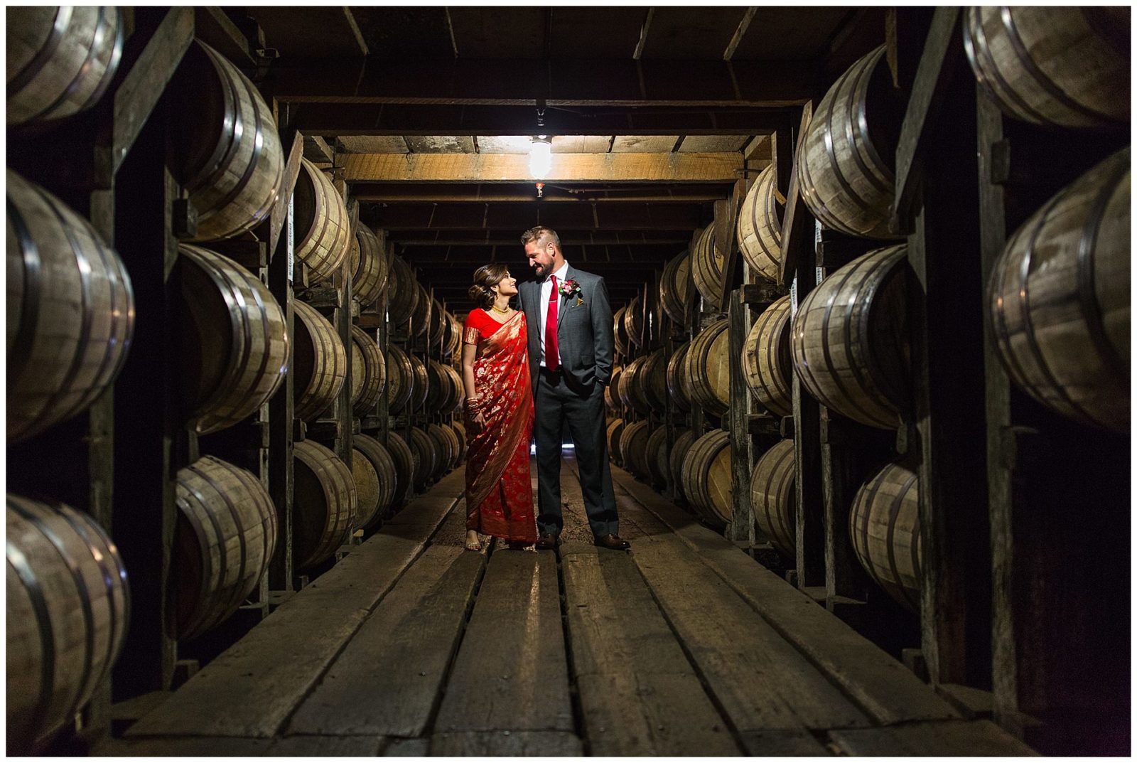 Bride and groom in the barrell room at Buffalo Trace Distillery in Frankfort, KY