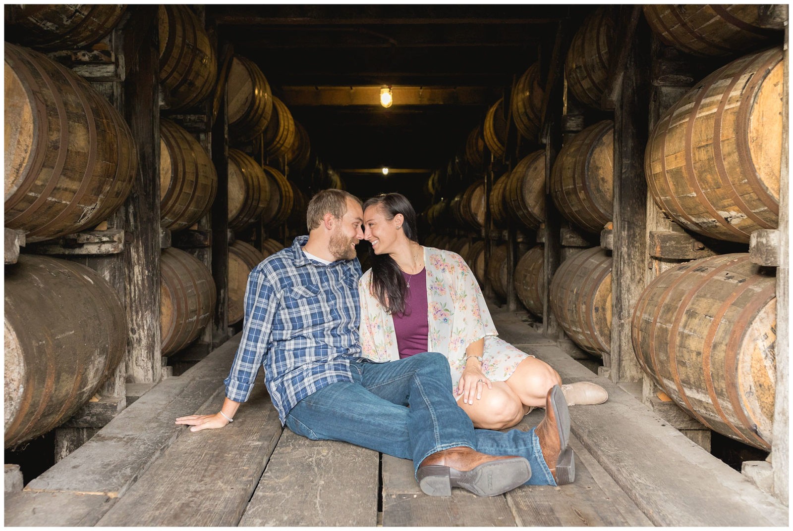 Engagement photos in the bourbon barrels warehouse at Buffalo Trace Distillery in Frankfort, KY
